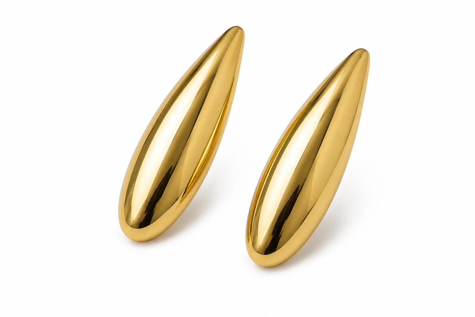 Two polished gold teardrop-shaped massage or beauty tools on a clean white background.