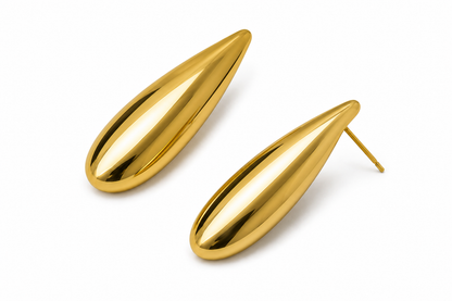 A pair of gold teardrop-shaped stud earrings with a highly polished, reflective finish, shown on a clean white background.